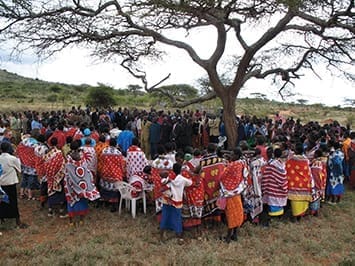 Maasai Christians often gather under trees for special occasions, although most congregations have built permanent church buildings. On this Sunday, church and community members of Miton (a village near the Kenya/Tanzania border) gathered for the ordination of five Community Christian Church pastors. (CCC is a registered association of CMF