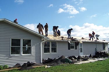 A GO!Group from Markle Church of Christ teams up with other churches to replace a roof at the Woodburn Christian Children
