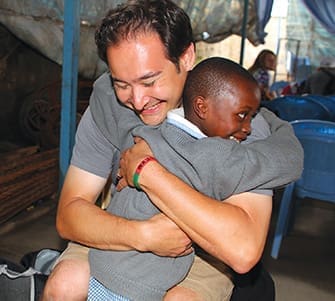 Adrian Stealey of West Side Christian Church, Springfield, Illinois, meets Yvonne at the Panagani School in Nairobi, Kenya, in 2013. Stealey