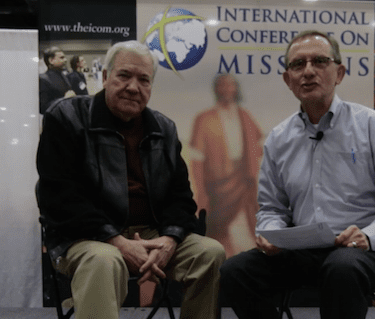 Dick Eastman (left) speaks with Mark A. Taylor at the 2014 International Conference on Missions.