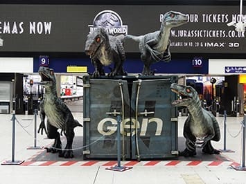 A velociraptor exhibit at Waterloo station in London, England, in June advertises the new Jurassic World movie. The film set box office records for opening weekend. (รยฉBen Sutherland; accessed via Wikimedia Commons)