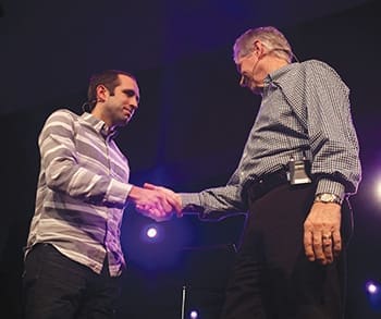 At the conclusion of the February 20 worship service, Ken Idleman (right) announced his retirement as senior pastor of Crossroads Christian Church, Newburgh, Indiana, and evangelism pastor Patrick Garcia, who has served with the church for three years, was introduced as the choice as the church