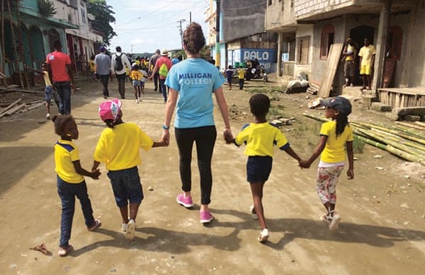 Abby Williams, a high school senior and a member of Lifepointe Church, Raleigh, North Carolina, walks with children during a trip to Ecuador in November 2015. Abby is the daughter of Donnie Williams, Lifepoint