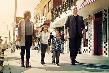 Steve and Tori Blake walk along South Congress Avenue in Austin with their children, Saylen, 8, and P.K., 5.