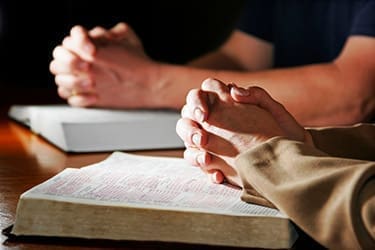 Praying Hands & Bibles