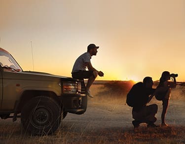 Travellers scene at sundown in Botsuana